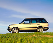 AUT 33 RK0133 07
2000 Range Rover Gold Profile View On Dirt Blue Sky