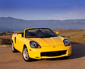 AUT 33 RK0142 07
2000 Toyota MR2 Spyder Yellow 3/4 Front View On Pavement Dry Grass Hills