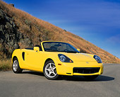 AUT 33 RK0143 11
2000 Toyota MR2 Spyder Yellow 3/4 Front View On Pavement By Dry Grass Hill