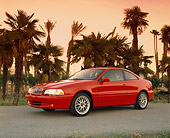 AUT 33 RK0156 11
2000 Volvo C70 Red 3/4 Side View On Pavement By Palm Trees Filtered