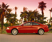 AUT 33 RK0159 01
2000 Volvo C70 Red Profile View On Pavement By Palm Trees Filtered
