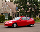 AUT 33 RK0174 02
2000 Honda Insight Hybrid Red 3/4 Side View On Pavement By House