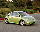 AUT 33 RK0195 03
2000 Volkswagen New Beetle Green 3/4 Front View On Pavement By Flowers And Trees