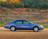 AUT 33 RK0209 02
2000 Ford Taurus SE Blue Profile View On Dirt