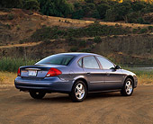 AUT 33 RK0210 07
2000 Ford Taurus SE Blue Rear 3/4 View On Dirt By Water