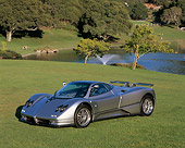 AUT 33 RK0226 02
2000 Zonda C12 S Silver 3/4 Front View On Grass By Water And Trees