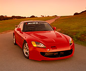 AUT 33 RK0266 02
2000 Honda S2000 Red 3/4 Front View On Pavement By Grass Hills Filtered