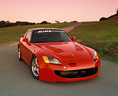 AUT 33 RK0267 02
2000 Honda S2000 Red 3/4 Front View On Pavement By Grass Hill Filtered