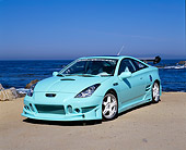 AUT 33 RK0295 09
2000 Toyota Celica Custom Mintgreen Pearl Blue 3/4 Front View On Sand By Ocean