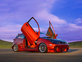 AUT 33 RK0348 01
2000 Ford Focus ZX3 Candy Apple Red Low 3/4 Side View On Pavement Doors Open