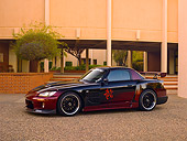 AUT 33 RK0360 01
2000 Honda S2000 Raspberry And Black 3/4 Side View On Pavement