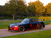 AUT 33 RK0361 01
2000 Honda S2000 Raspberry And Black Low 3/4 Side View On Pavement