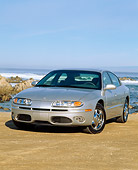 AUT 34 RK0035 04
2001 Oldsmobile Aurora V8 Silver 3/4 Front View On Sand Ocean Blue Sky