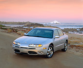 AUT 34 RK0041 01
2001 Oldsmobile Aurora V8 Silver 3/4 Front View On Sand By Ocean At Dusk