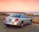 AUT 34 RK0044 03
2001 Oldsmobile Aurora V8 Silver 3/4 Rear View On Pavement By Ocean Filtered