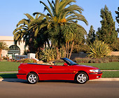 AUT 34 RK0114 02
2001 Saab 93 Convertible Red Profile View On Pavement By Grass And Palm Trees