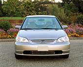 AUT 34 RK0140 01
2001 Honda Civic EX Champagne Head On Shot On Pavement By Flowers And Trees