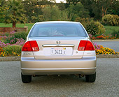AUT 34 RK0142 02
2001 Honda Civic EX Champagne Rear Shot On Pavement By Flowers And Trees