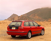AUT 34 RK0009 02
2001 Volvo V40 Red 3/4 Rear View On Sand Overcast By Hills