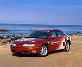 AUT 34 RK0045 01
2001 Oldsmobile Aurora Indy 500 Pace Car 3/4 Front View On Sand By Ocean Blue Sky