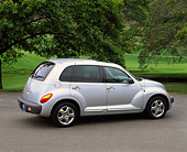AUT 34 RK0060 03
2001 Chrysler PT Cruiser Silver 3/4 Rear View On Pavement By Trees