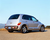 AUT 34 RK0072 02
2001 Chrysler PT Cruiser Silver 3/4 Rear View On Pavement Blue Sky