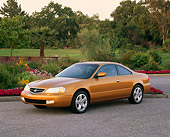 AUT 34 RK0077 06
2001 Acura 3.2CL Gold 3/4 Front View On Pavement By Flowers And Trees