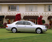 AUT 34 RK0105 03
2001 Lexus LS430 Silver 3/4 Front View On Grass By Building