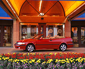 AUT 34 RK0109 06
2001 Saab 9-3 Convertible Red 3/4 Side View In Front Of Entrance By Flowers