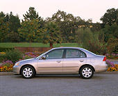 AUT 34 RK0139 02
2001 Honda Civic EX Champagne Profile View On Pavement By Flowers And Trees