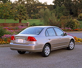 AUT 34 RK0141 03
2001 Honda Civic EX Champagne 3/4 Rear View On Pavement By Flowers And Trees