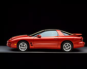 AUT 34 RK0175 06
2001 Pontiac Firebird Trans Am Sunset Orange Profile View On Gray Floor Studio