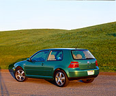 AUT 34 RK0255 01
2001 VW GTI GLS 1.8 T Green Rear 3/4 View On Pavement By Grass Hill At Dusk