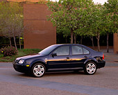AUT 34 RK0264 02
2001 VW Jetta GLS 1.8T Blue Side 3/4 View On By Building And Trees