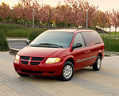 AUT 34 RK0278 02
2001 Dodge Grand Caravan Sport Red 3/4 Front View On Pavement By Steps And Pink Flower Trees
