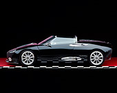 AUT 34 RK0321 05
2001 Spyker C8 Spyder Black Profile View On Checkered Line Red Floor Studio