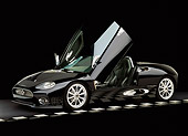 AUT 34 RK0323 14
2001 Spyker C8 Spyder Black Side 3/4 View Doors Open Checkered Line Black Floor Studio