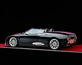 AUT 34 RK0326 11
2001 Spyker C8 Spyder Black Rear 3/4 View On Red Floor Gray Line Studio