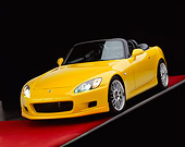 AUT 34 RK0338 02
2001 Honda S2000 Convertible Yellow 3/4 Front View On Gray Line Red Floor Studio