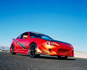 AUT 34 RK0377 01
2001 Acura Integra Orange Custom Low 3/4 Front View On Pavement Blue Sky