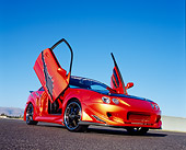 AUT 34 RK0385 04
2001 Acura Integra Orange Low 3/4 Front View On Pavement Blue Sky