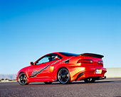 AUT 34 RK0386 02
2001 Acura Integra Orange Low 3/4 Rear View On Pavement Blue Sky