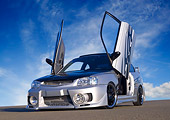 AUT 34 RK0390 01
2001 Hyundai Accent Silver Low 3/4 Front View On Pavement Doors Open