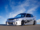 AUT 34 RK0391 01
2001 Hyundai Accent Silver Low 3/4 Front View On Pavement Doors Open