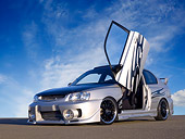 AUT 34 RK0392 01
2001 Hyundai Accent Silver Low 3/4 Front View On Pavement Doors Open