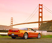 AUT 35 RK0158 04
2002 Acura NSX Imola Orange Low 3/4 Rear View On Pavement By SF Bridge Filtered