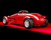 AUT 35 RK0196 01
2002 Torpedo Roadster Custom Red 3/4 Rear View On Red Floor Studio
