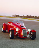 AUT 35 RK0207 09
2002 Torpedo Roadster Custom Red 3/4 Front View On Pavement Filtered