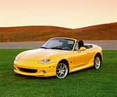 AUT 35 RK0260 01
2002 Mazda Miata Special Edition Yellow 3/4 Front View On Grass Filtered