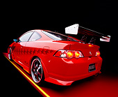 AUT 35 RK0343 06
2002 Acura RSX Type S Red With Graphics Modify By APC Wide Angle 3/4 Rear Side View On Red Floor Studio
